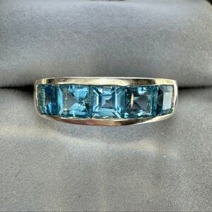 Vintage Princess cut Blue Topaz Raised band ring. Size about an 8